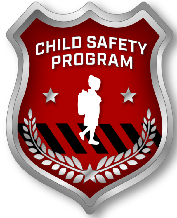 A red police badge with Child Safety Program inscribed